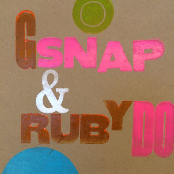 A hand-inked letterpress print reading Snap and Ruby Do on kraft paper